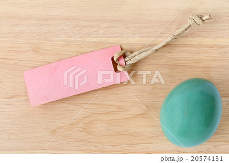 Blank paper tag and easter egg on wood background. Blank paper tag and easter egg on wood background. 20574131