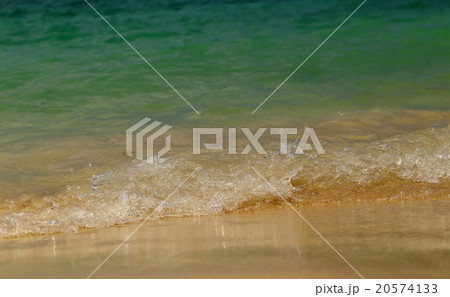 Wave of the sea on sandy beach. 20574133