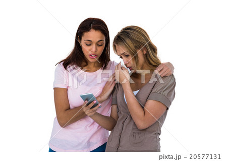 Girl comforting her friend Girl comforting her friend 20577131
