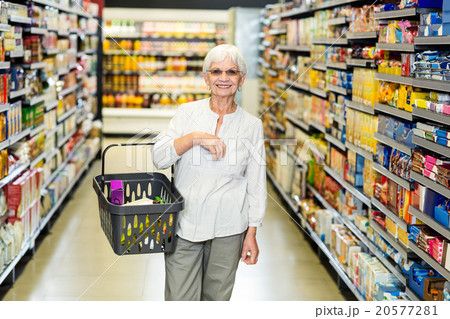 Smiling senior woman with basket Smiling senior woman with basket 20577281