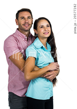 Thoughtful smiling couple hugging 20577282