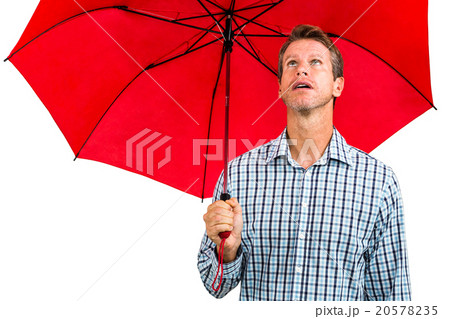 Man holding red umbrella 20578235