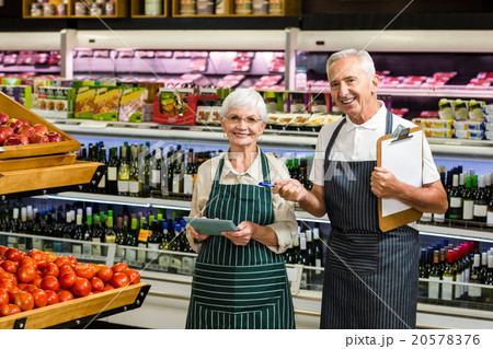 Smiling senior workers with clipboard 20578376