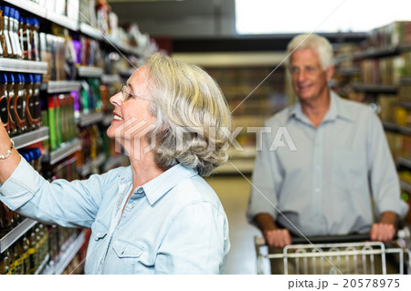 Smiling senior woman choosing food 20578975