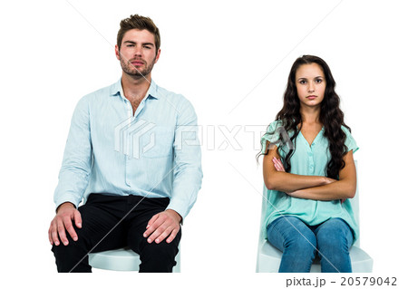 Couple sitting on chairs not talking after argument 20579042