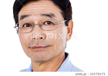 Close-up portrait of confident man wearing eyeglasses 20579275