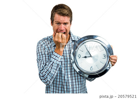 Anxious late man holding a clock Anxious late man holding a clock 20579521