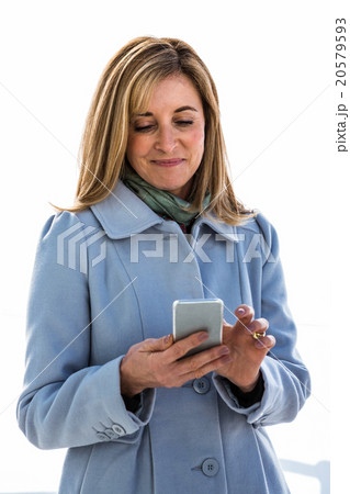 woman looking at her phone 20579593