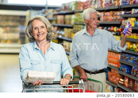 Smiling senior couple buying food 20580063