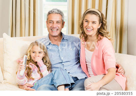 Happy family sitting together 20580355