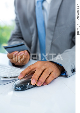 Businessman holding business card 20580437