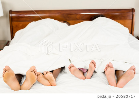 Parents and kids feet at the end of the bed Parents and kids feet at the end of the bed 20580717