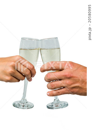 Cropped hand of couple toasting champagne flute 20580995