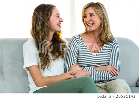 Mother and daughter smiling Mother and daughter smiling 20581143