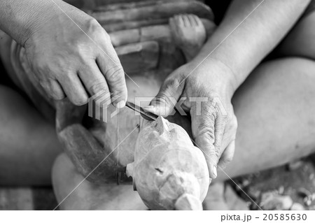 Hand of carver carving wood  20585630
