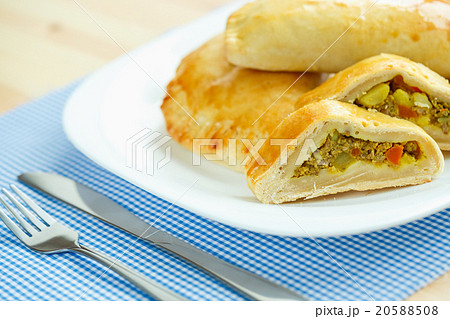 Tasty cake stuffed with meat on a white plate Tasty cake stuffed with meat on a white plate 20588508