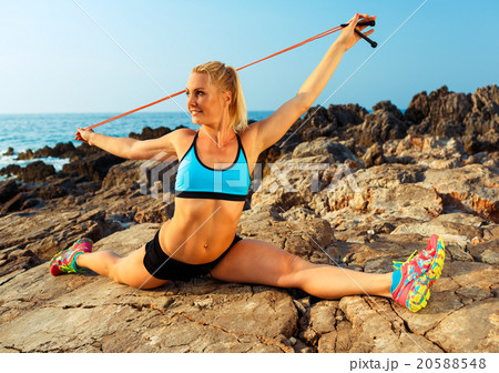 Athlete woman doing sport exercising with the rope 20588548