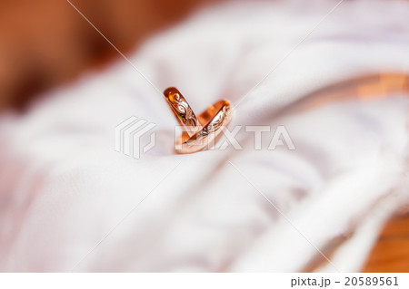 Golden wedding rings with ornament on silk. Golden wedding rings with ornament on silk. 20589561