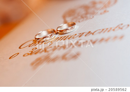 Golden wedding rings on background with monogram. Golden wedding rings on background with monogram. 20589562