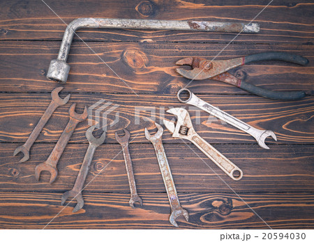 Hammer and rusty nail on white wooden background Hammer and rusty nail on white wooden background 20594030