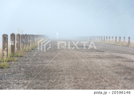 Lonely man running on misty autumn morning Lonely man running on misty autumn morning 20596146