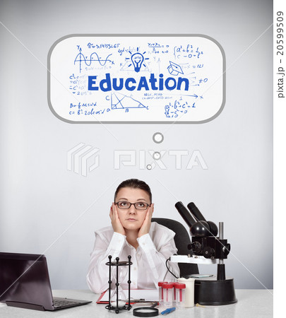 female scientist sitting in laboratory 20599509