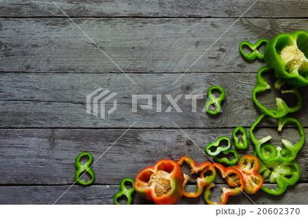 Photo of sliced peppers over wooden table Photo of sliced peppers over wooden table 20602370