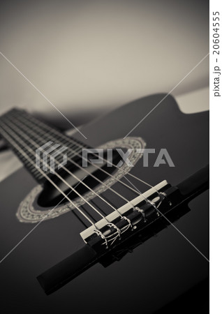 black acoustic guitar 20604555