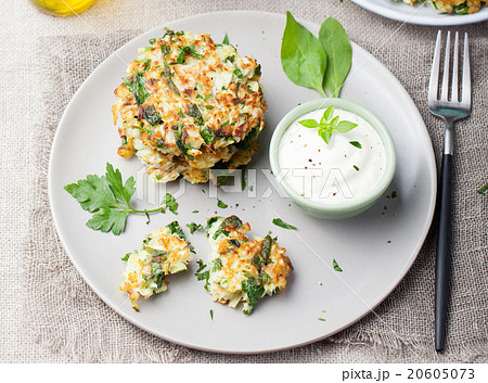 Cabbage and spinach pancakes with yogurt dressing Cabbage and spinach pancakes with yogurt dressing 20605073