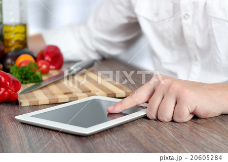 Cooking, technology and home concept. Tablet, pc. 20605284