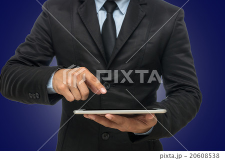 Businessman using the tablet on blue background, include clippin Businessman using the tablet on blue background, include clippin 20608538