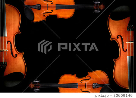 Violin orchestra musical instruments on black background 20609146