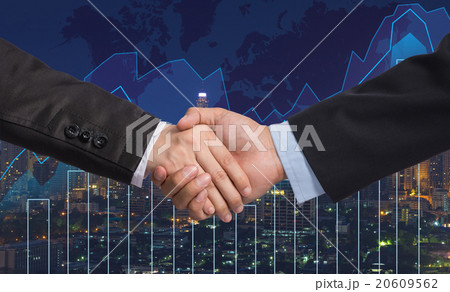 Hand shake between businessman on Trading graph on the cityscape Hand shake between businessman on Trading graph on the cityscape 20609562