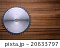 Circular saw blade on wooden background 20633797