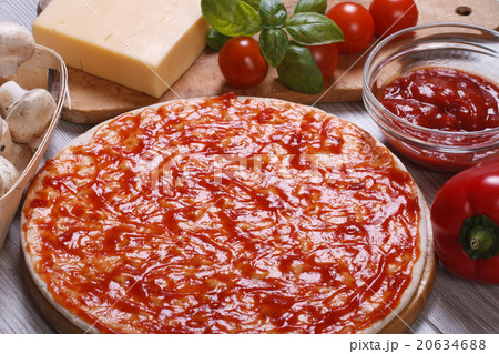 Basis for pizza with tomato sauce and ingredients Basis for pizza with tomato sauce and ingredients 20634688