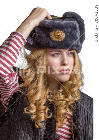 Beautiful  girl wearing a  soldier's cap 20641535