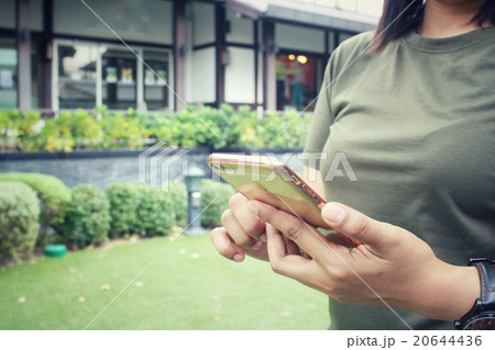 Woman using smart phone Woman using smart phone 20644436