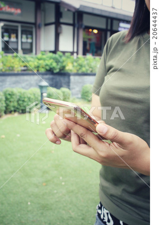 Woman using smart phone Woman using smart phone 20644437