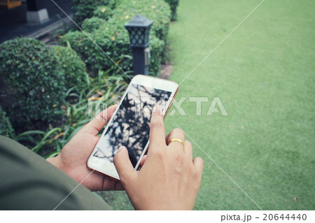 Woman using smart phone 20644440