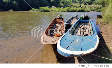 Three boats were tied up in the river with blue Three boats were tied up in the river with blue 20646116