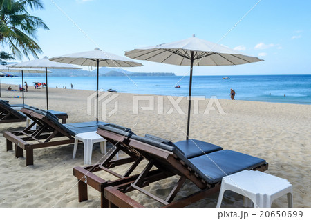 Beach chair under the umbrella on the beach Beach chair under the umbrella on the beach 20650699
