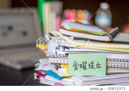Submit By Friday; Stack of Documents and Laptop Submit By Friday; Stack of Documents and Laptop 20653371