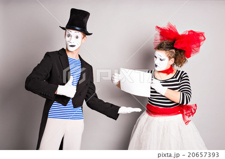 Two mimes   with a sign for advertising, April 20657393