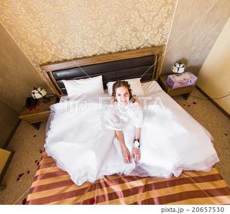 Funny beautiful bride in her bedroom Funny beautiful bride in her bedroom 20657530