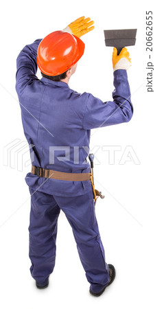 Worker in red protective helmet. 20662655