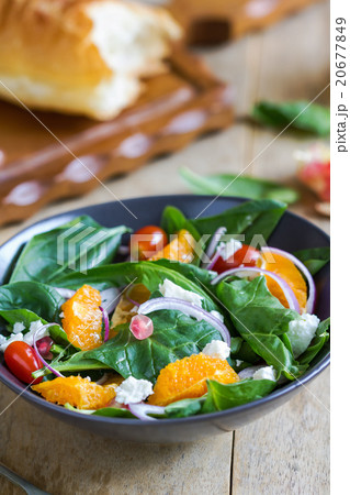 Orange with spinach and pomegranate salad 20677849