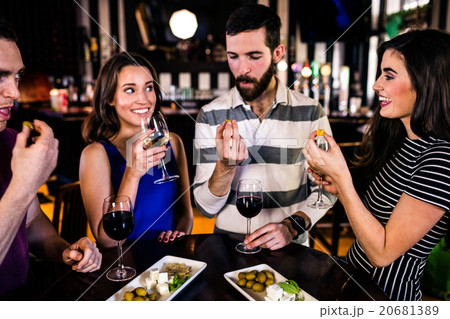 Friends having an aperitif with wine Friends having an aperitif with wine 20681389