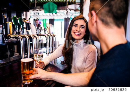 Cute couple having a drink Cute couple having a drink 20681626