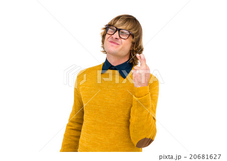 Portrait of hipster crossing his fingers Portrait of hipster crossing his fingers 20681627