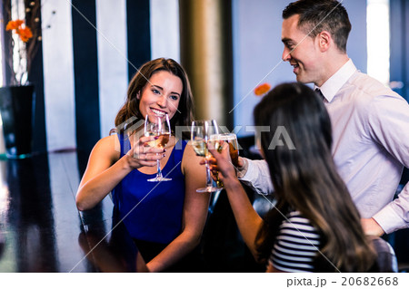 Friends toasting together Friends toasting together 20682668